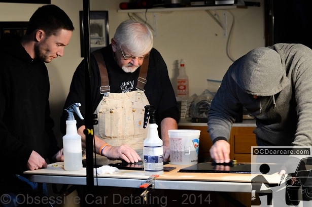 Jason Killmer (The Phantom Polisher) instructs Don Porter and Christopher Brown, of OCDCarCare, on Color Sanding during the cold and rainy Seattle Shine Bonanza 2013. OCDCarCare takes instruction from Jason Killmer - The Phantom Polisher; world class wet sanding instructor.