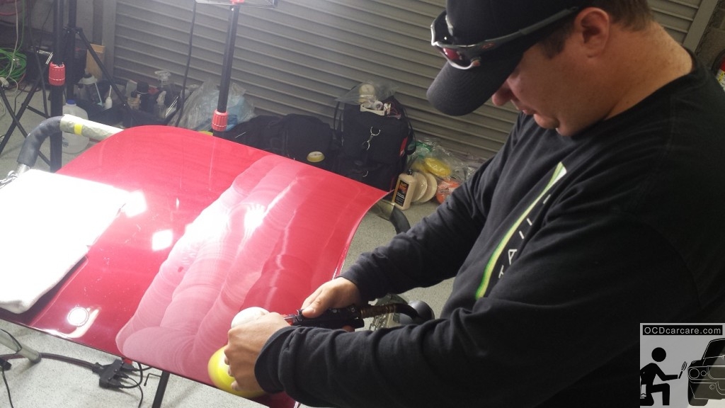 Scott Nichols of Distinct Detail patiently final polishes the delicate tonneau cover of the 1956 Maserati 150S for the 2014 Pebble Beach Concours d' Elegance Scott Nichols of Distinct Detail patiently final polishes the delicate tonneau cover of the 1956 Maserati 150S for the 2014 Pebble Beach Concours d' Elegance