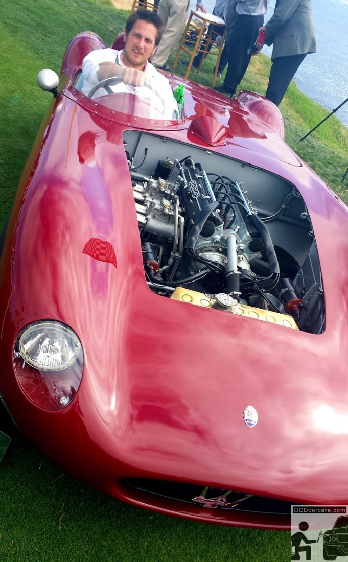 Christopher Brown of OCDCarCare sits in the 1956 Maserati 150S on the lawn at the 2014 Pebble Beach Concours d' Elegance. Christopher Brown of OCDCarCare Los Angeles sits in the 1956 Maserati 150S on the lawn at the 2014 Pebble Beach Concours d' Elegance.